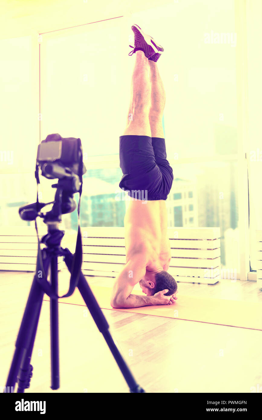 Sporty handsome man exercising on the floor in a room Stock Photo Alamy Sporty handsome man exercising on the floor in a room Stock Photo Alamy