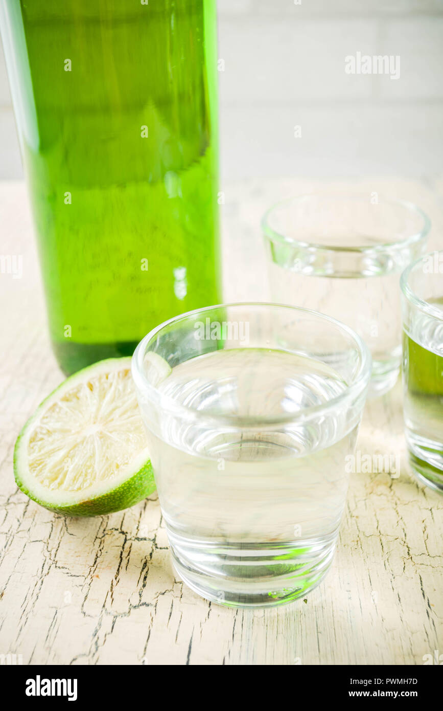 Traditional korean alcohol drink soju on light concrete background copy