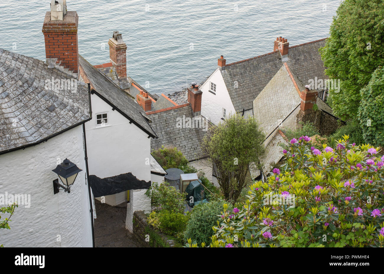 View down to rooftops and sea at Clovelly in Devon, England. Stock Photo