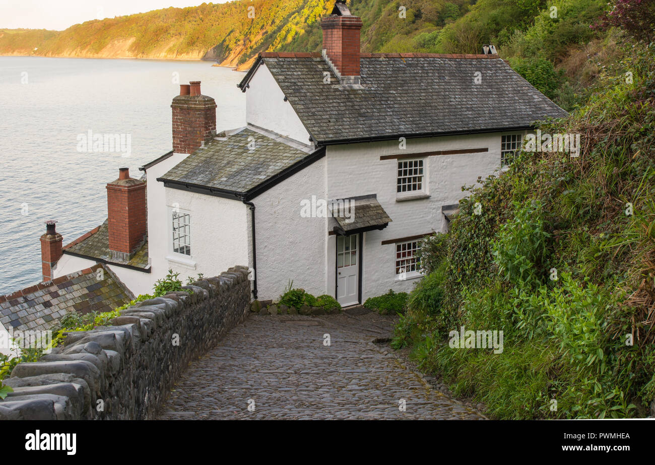 Whitewashed cottage on cliff edge at Clovelly in North Devon, England Stock Photo