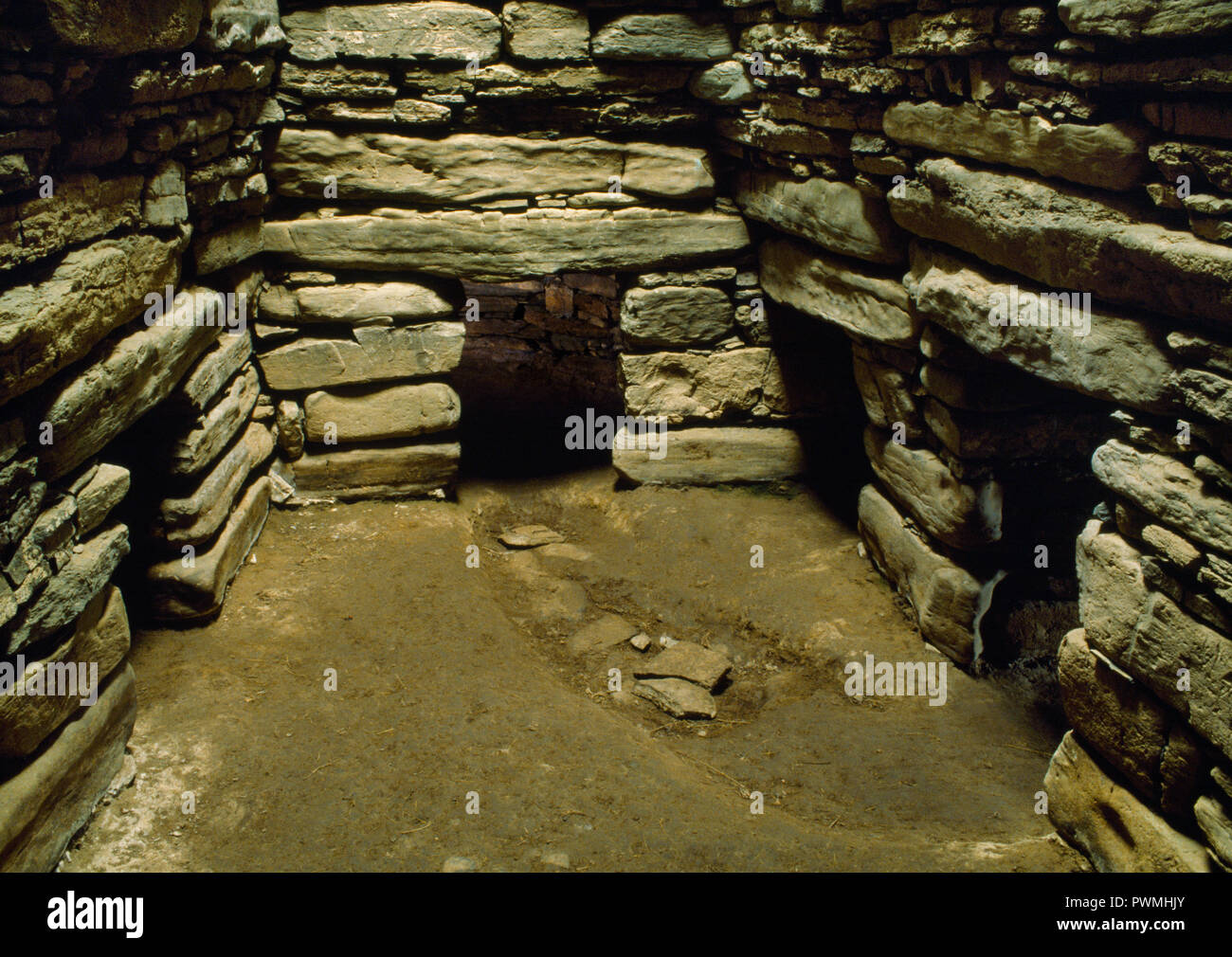 View NE of the interior of Quoyness Neolithic chambered cairn, Sanday, Orkney, showing entrance (1st R) & 3 of the 6 burial cells off the main chamber Stock Photo
