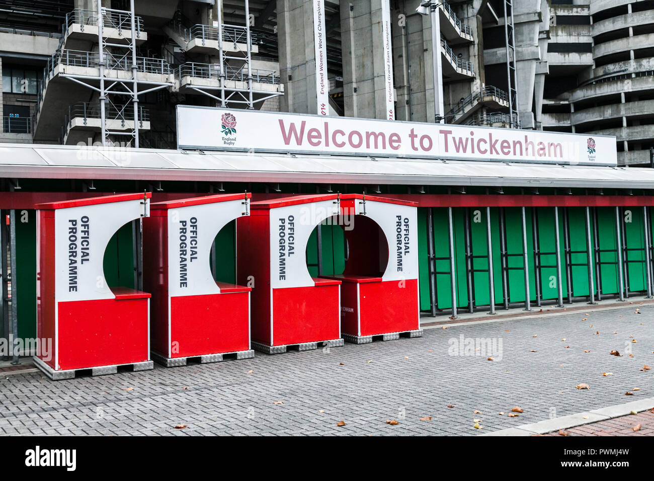 The red programme booths and green turnstiles at the rear of Twickenham Stadium, home of English Rugby, in London,England,UK Stock Photo