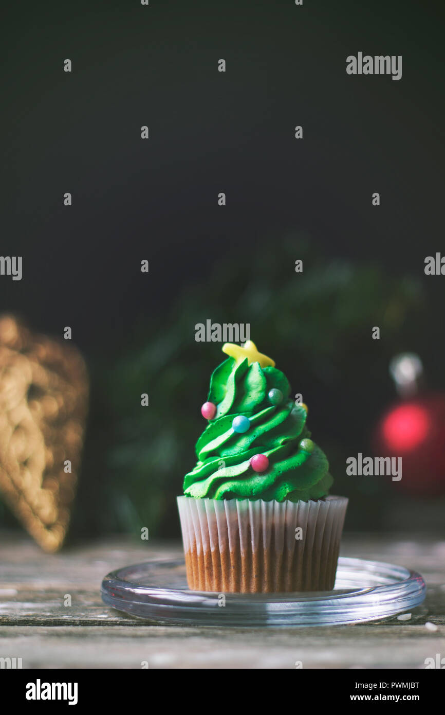 Homemade cupcake decorated as christmas tree; christmas or new year background with copy space Stock Photo