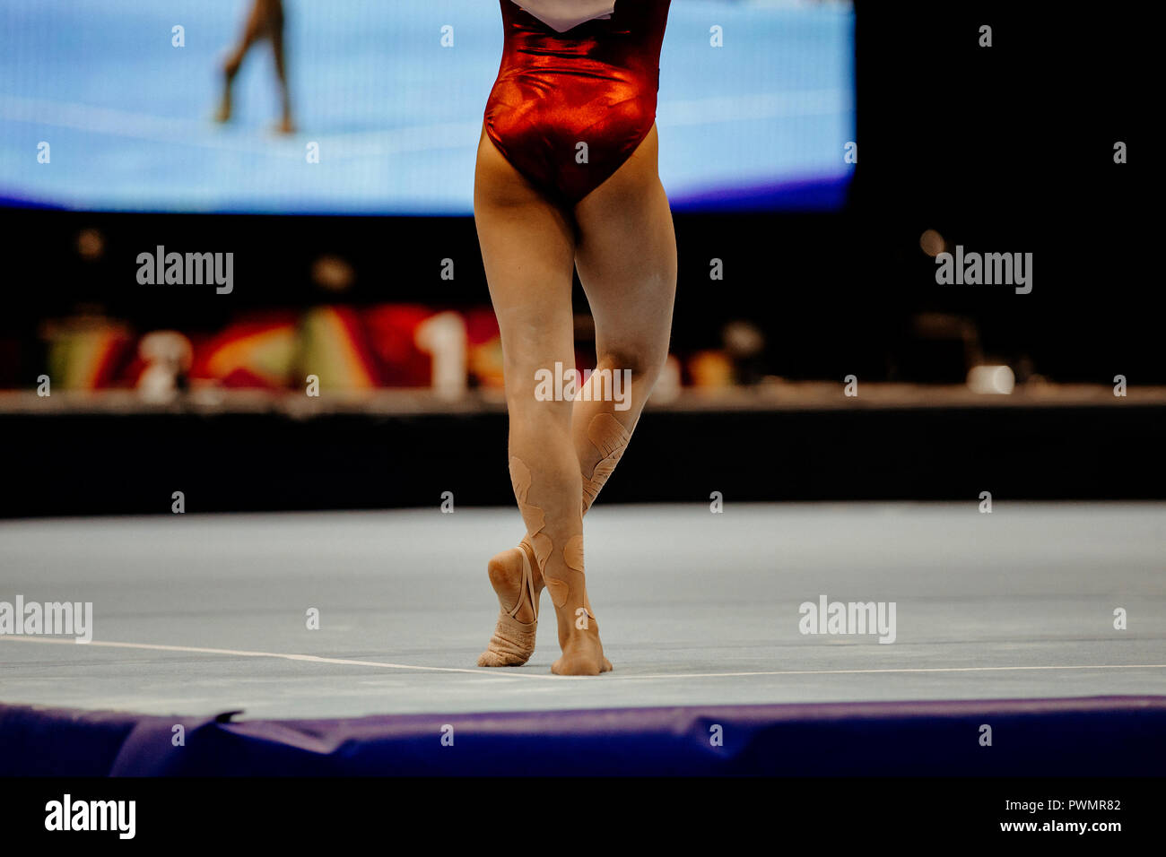 floor exercise back legs female gymnast at gymnastics championship Stock Photo
