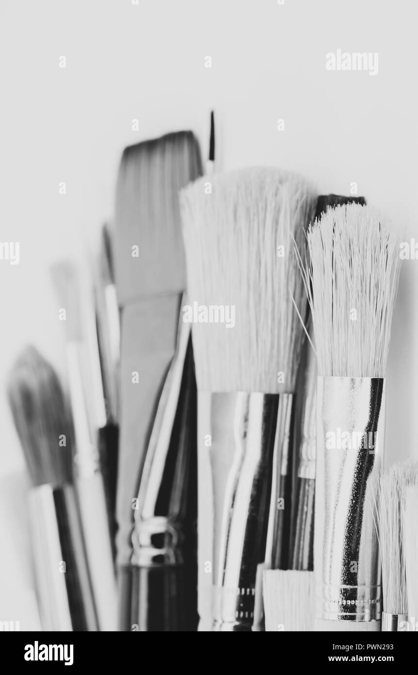 set of painting brushes on empty surface backdrop - visual arts concept Stock Photo