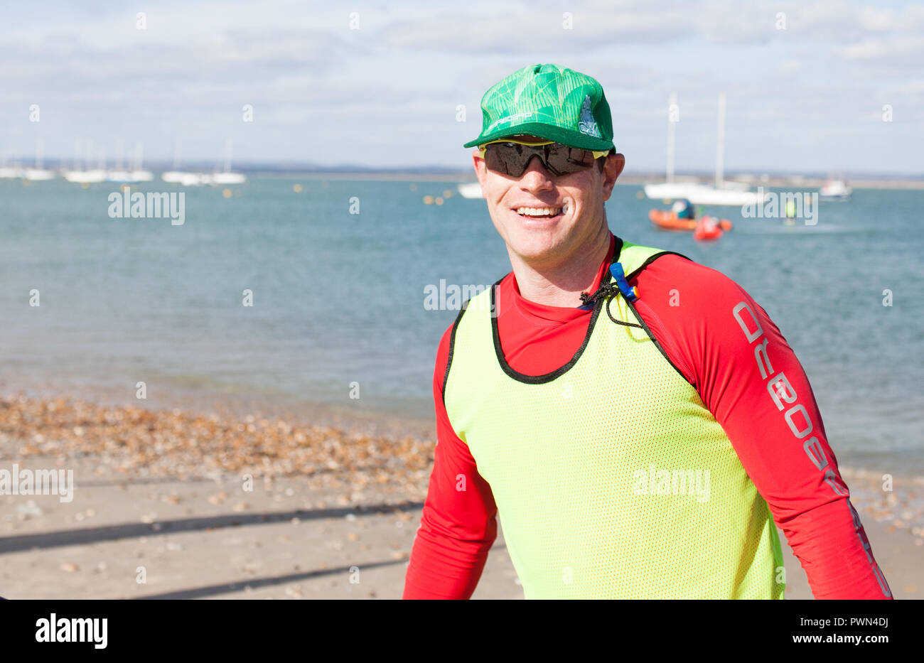 Paddle board winner finishing Stock Photo Alamy