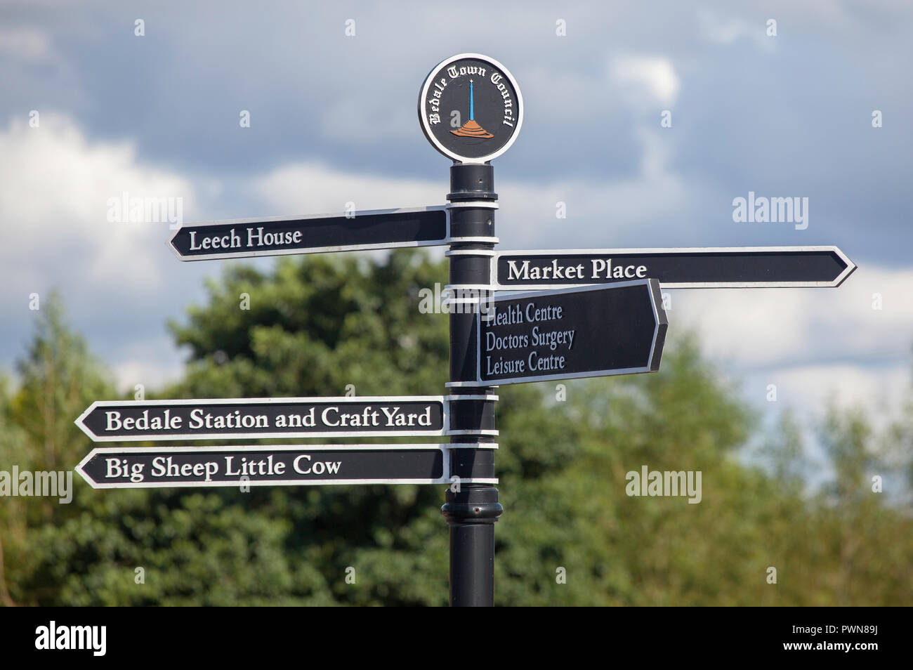 Pedestrian direction sign pointing to attractions around Bedale in North Yorkshire Stock Photo