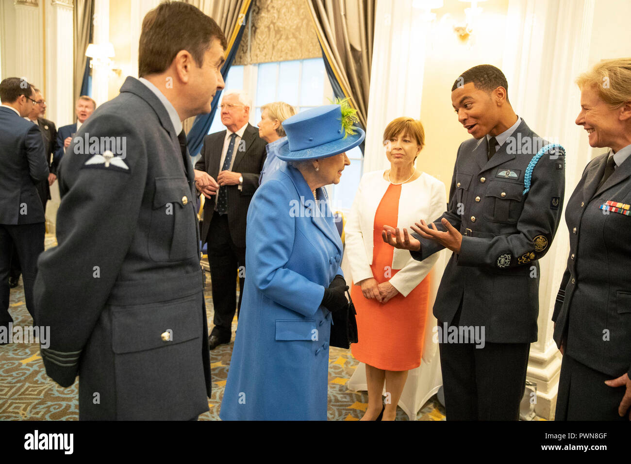 Queen Elizabeth II at the Royal Air Force Club in London for a visit to mark its centenary year