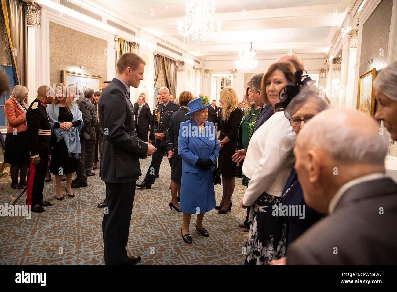 Queen Elizabeth II at the Royal Air Force Club in London for a visit to mark its centenary year
