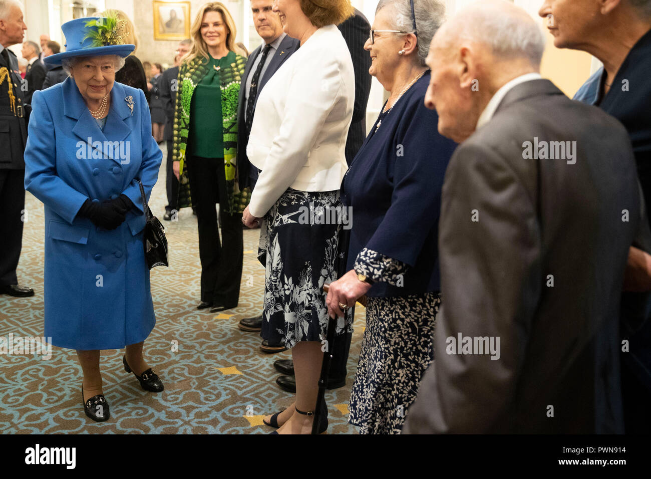 Queen Elizabeth II at the Royal Air Force Club in London for a visit to mark its centenary year