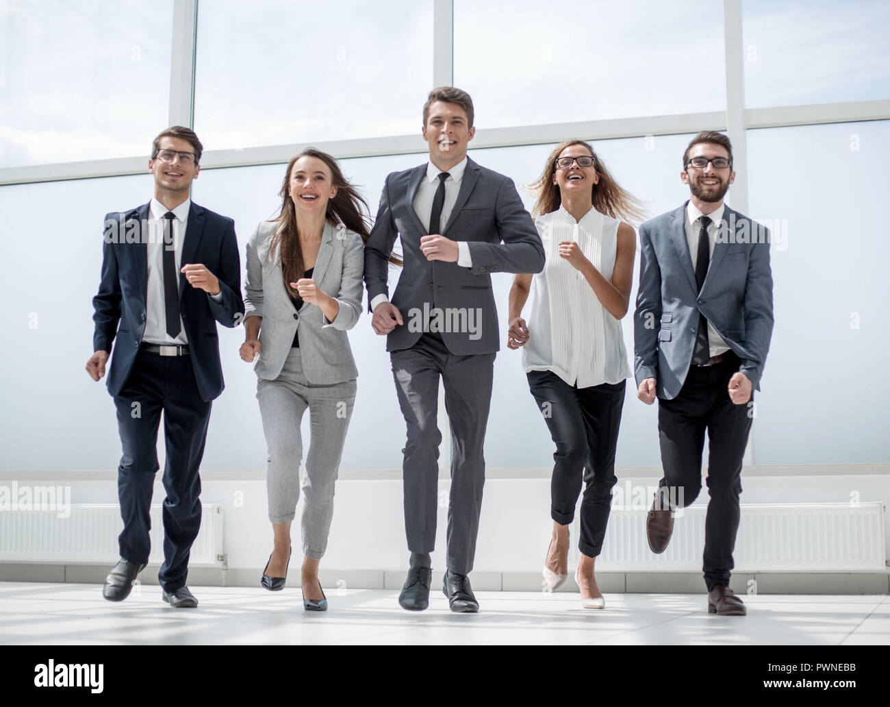 in full growth.a group of business people walking together Stock Photo ...