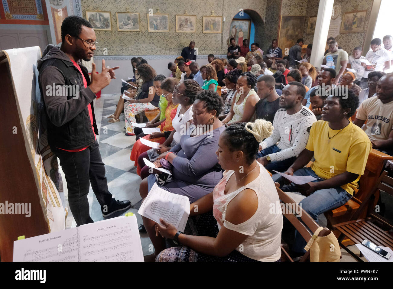 Church service for Refugees in the Assumption of Virgin Mary Church in the island's capital, Mytilini, Lesvos Island, Greece, May 2018 Stock Photo