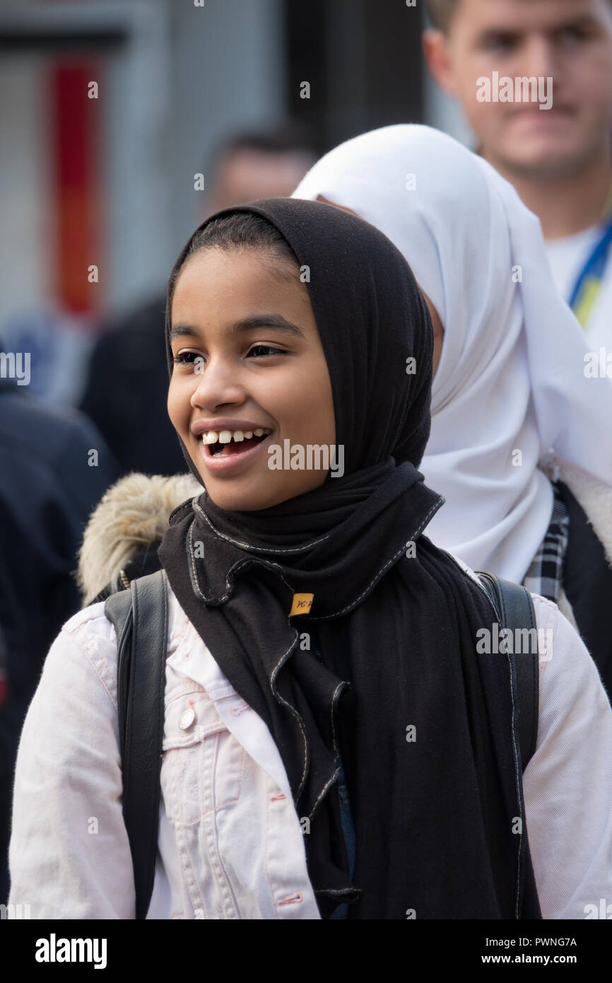 Young Muslim girl in the street wearing a hijab headscarf Stock Photo ...