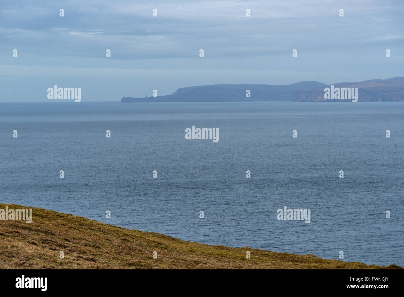 Lighthouse, Dunnet Head, Island of Stroma in the background, north coast, Scotland, Uk Stock Photo