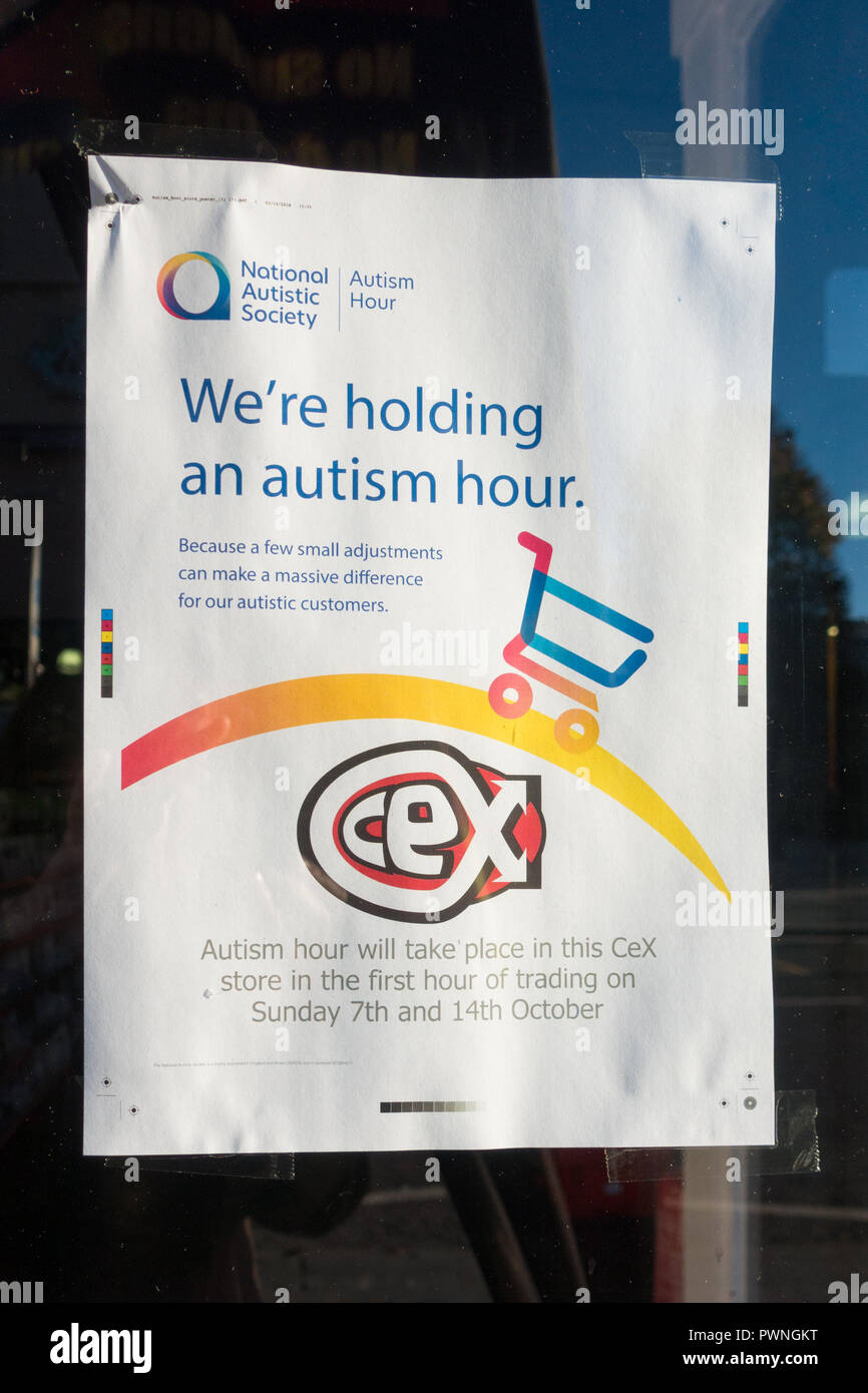Autism Hour advertising poster in CeX shop window, Dundee, Scotland, UK Stock Photo