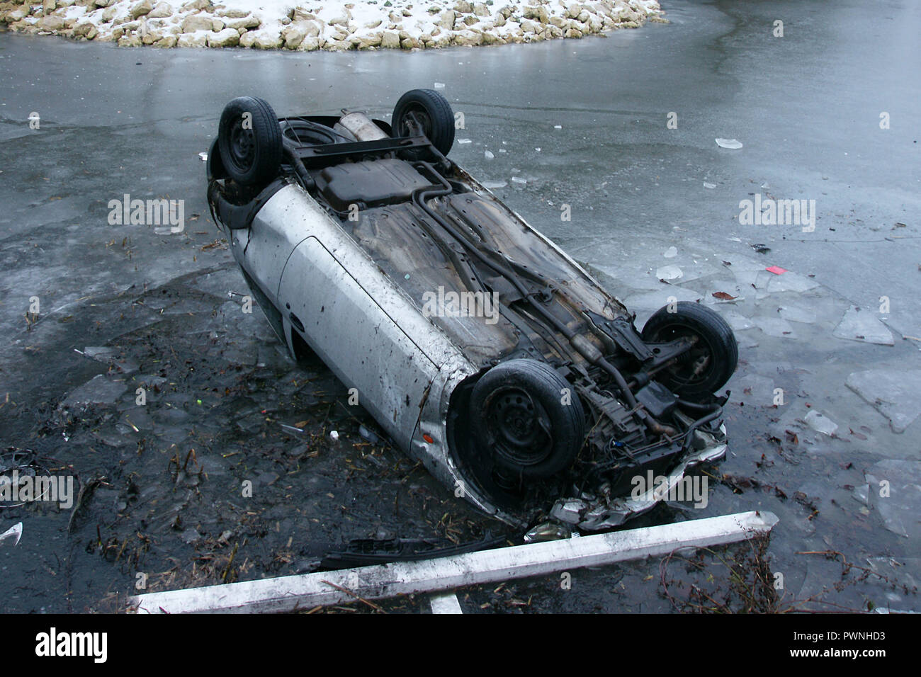 road traffic collision, car crash into pond, black ice Stock Photo