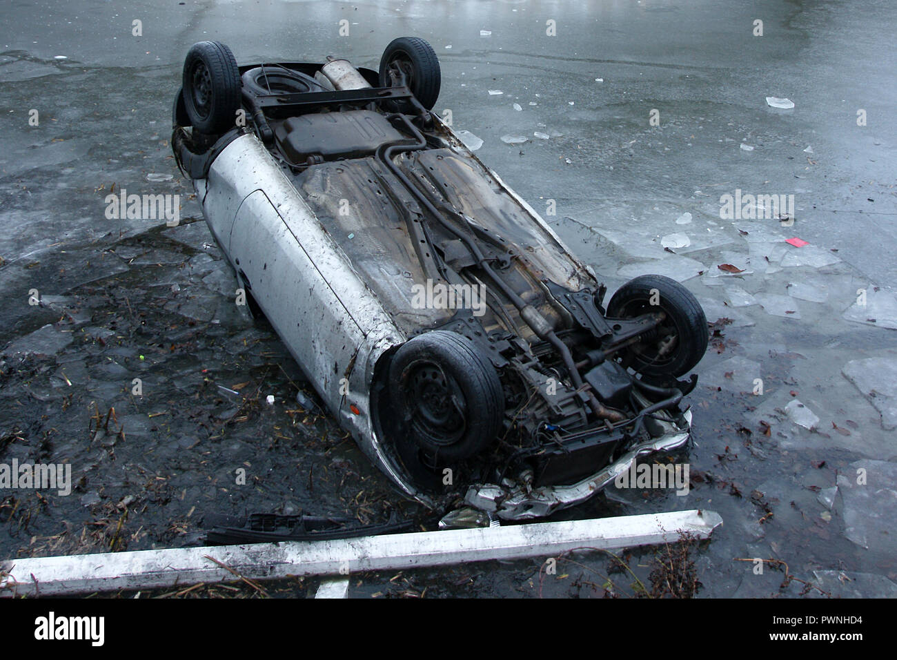 road traffic collision, car crash into pond, black ice Stock Photo