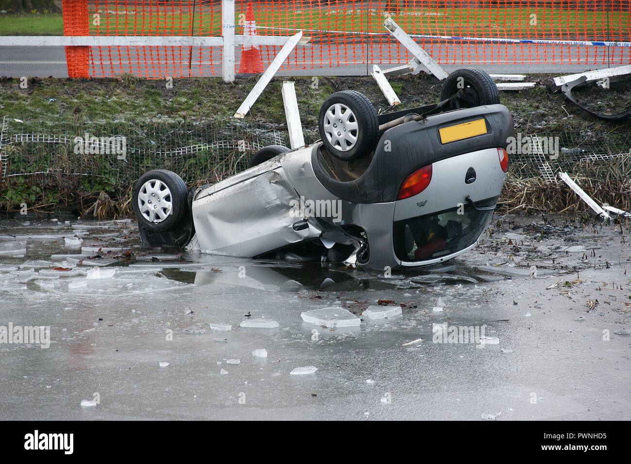 road traffic collision, car crash into pond, black ice Stock Photo