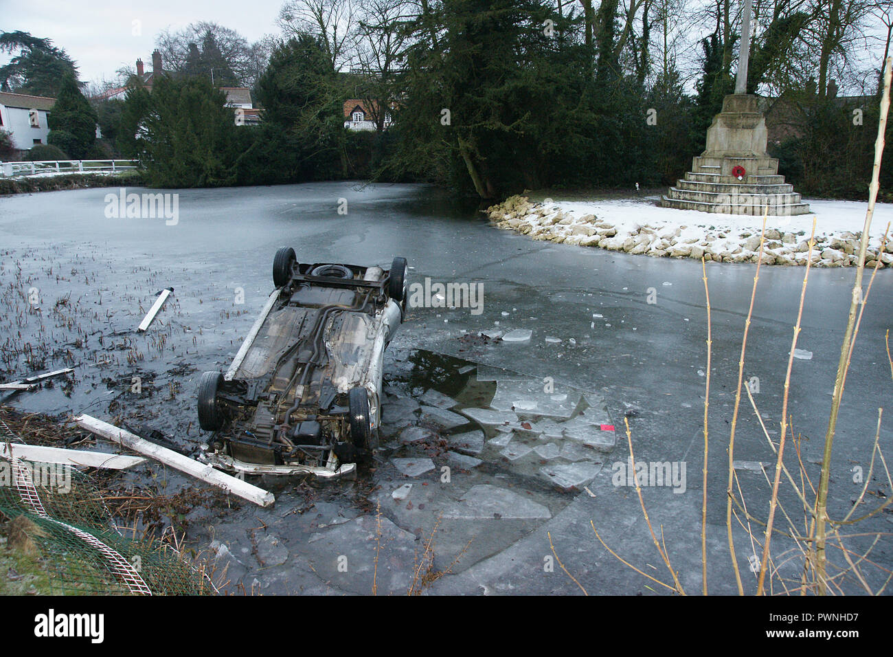 road traffic collision, car crash into pond, black ice Stock Photo