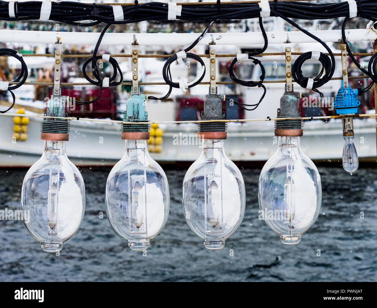 Squid Fishing Boat lights Hakodate Japan - powerful lights on board Japanese Squid fishing boats attract squid to the surface at night Stock Photo
