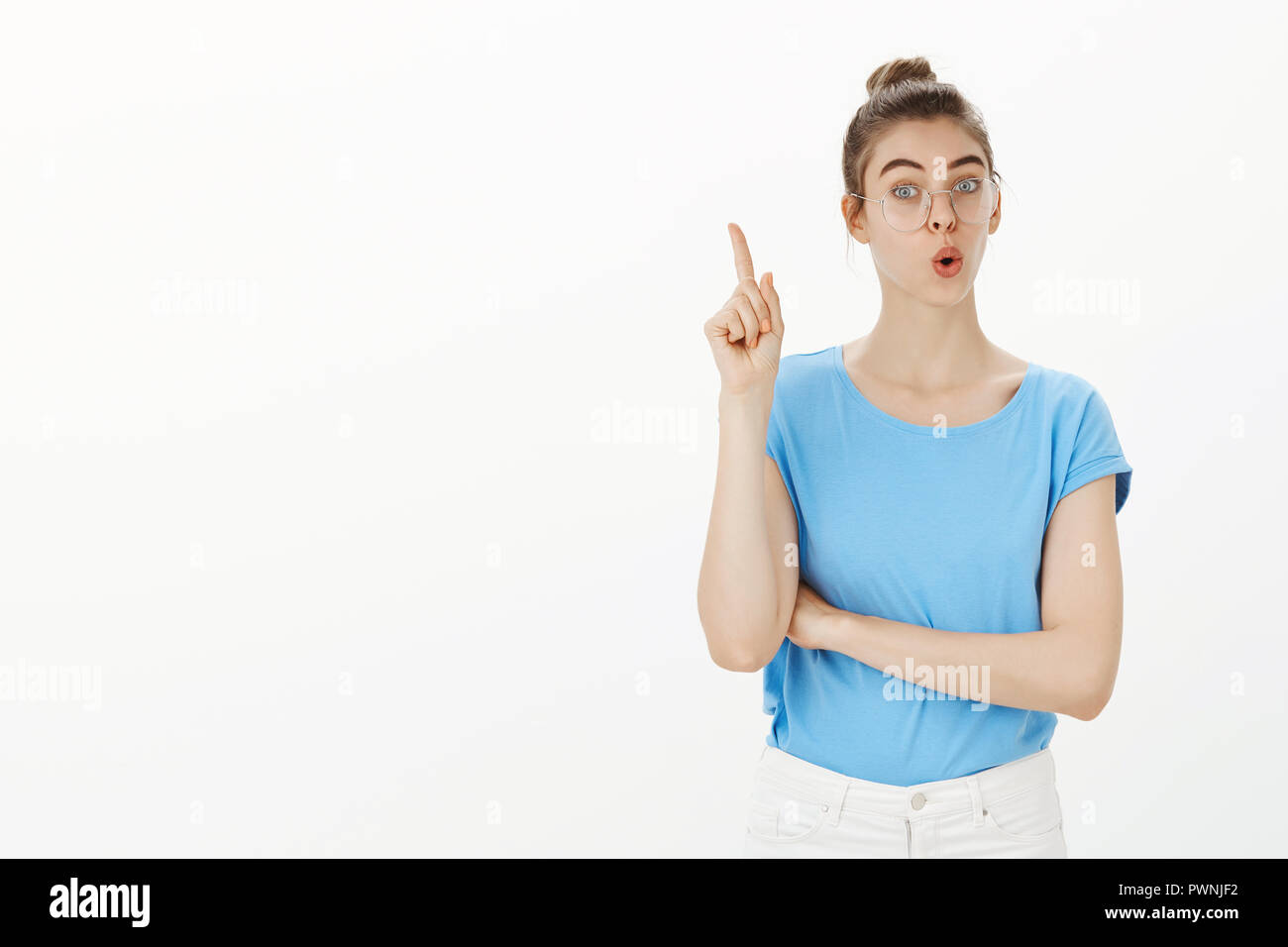 Woman student raising finger hi-res stock photography and images - Alamy