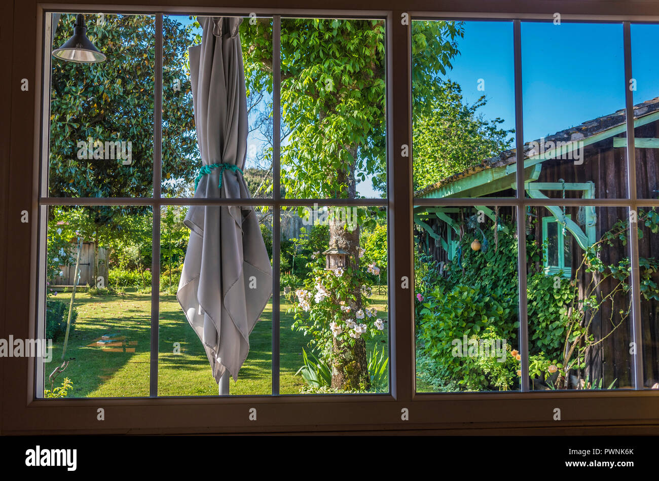 Veranda umbrella hi-res stock photography and images - Alamy