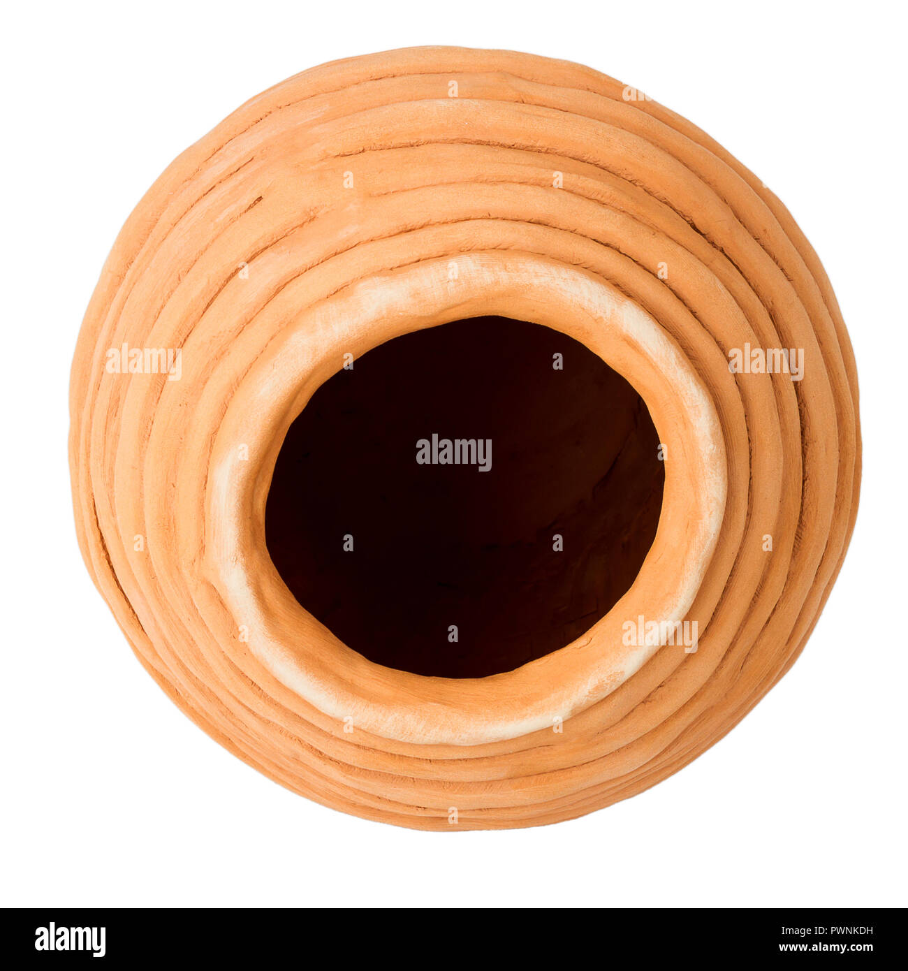 Unglazed handmade coiled pottery pot made of red clay isolated on white