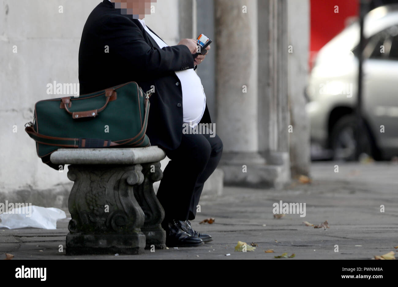 Pic shows: Obese man sitting on a bench    pic by Gavin Rodgers/Pixel8000 Stock Photo