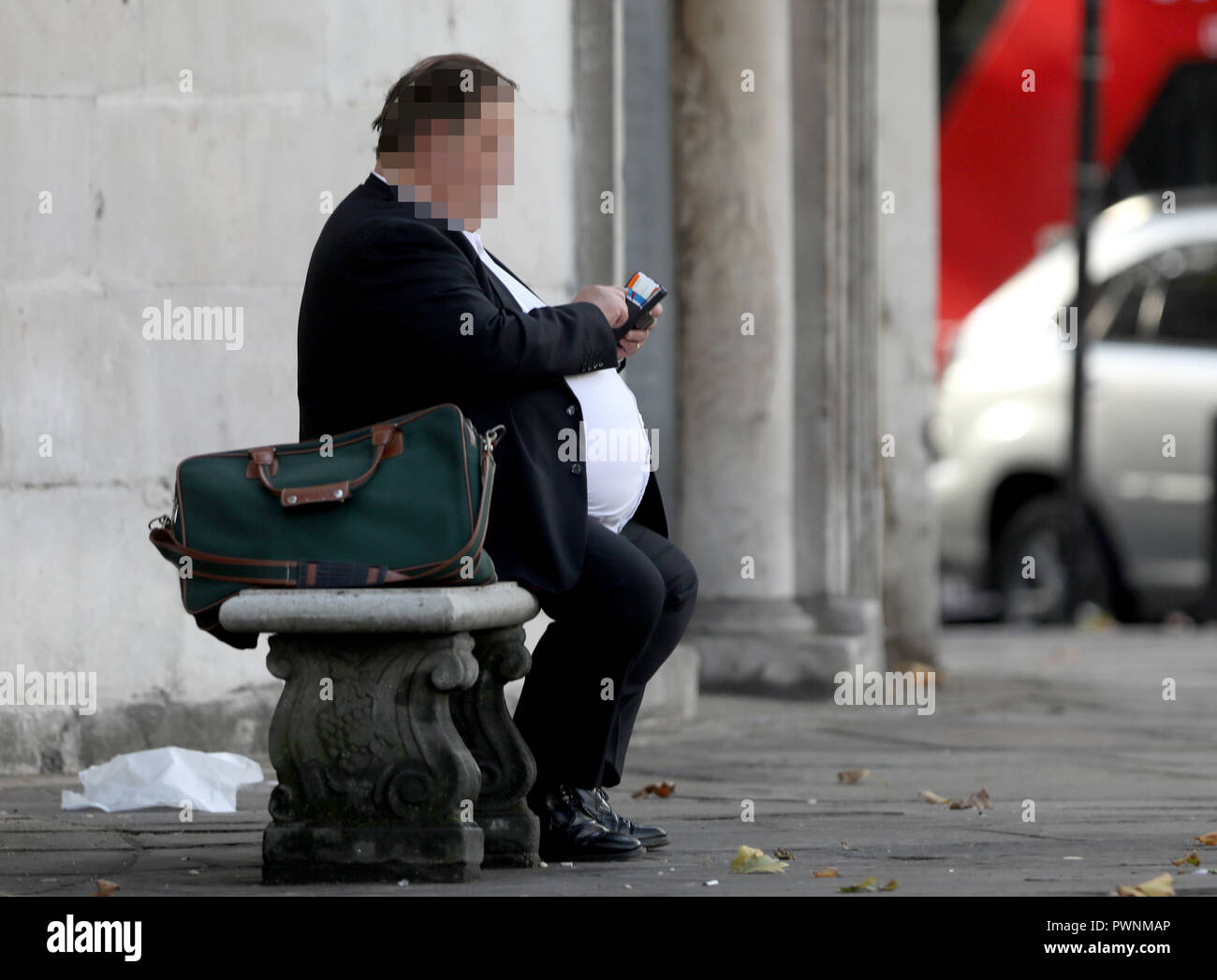 Pic shows: Obese man sitting on a bench    pic by Gavin Rodgers/Pixel8000 Stock Photo