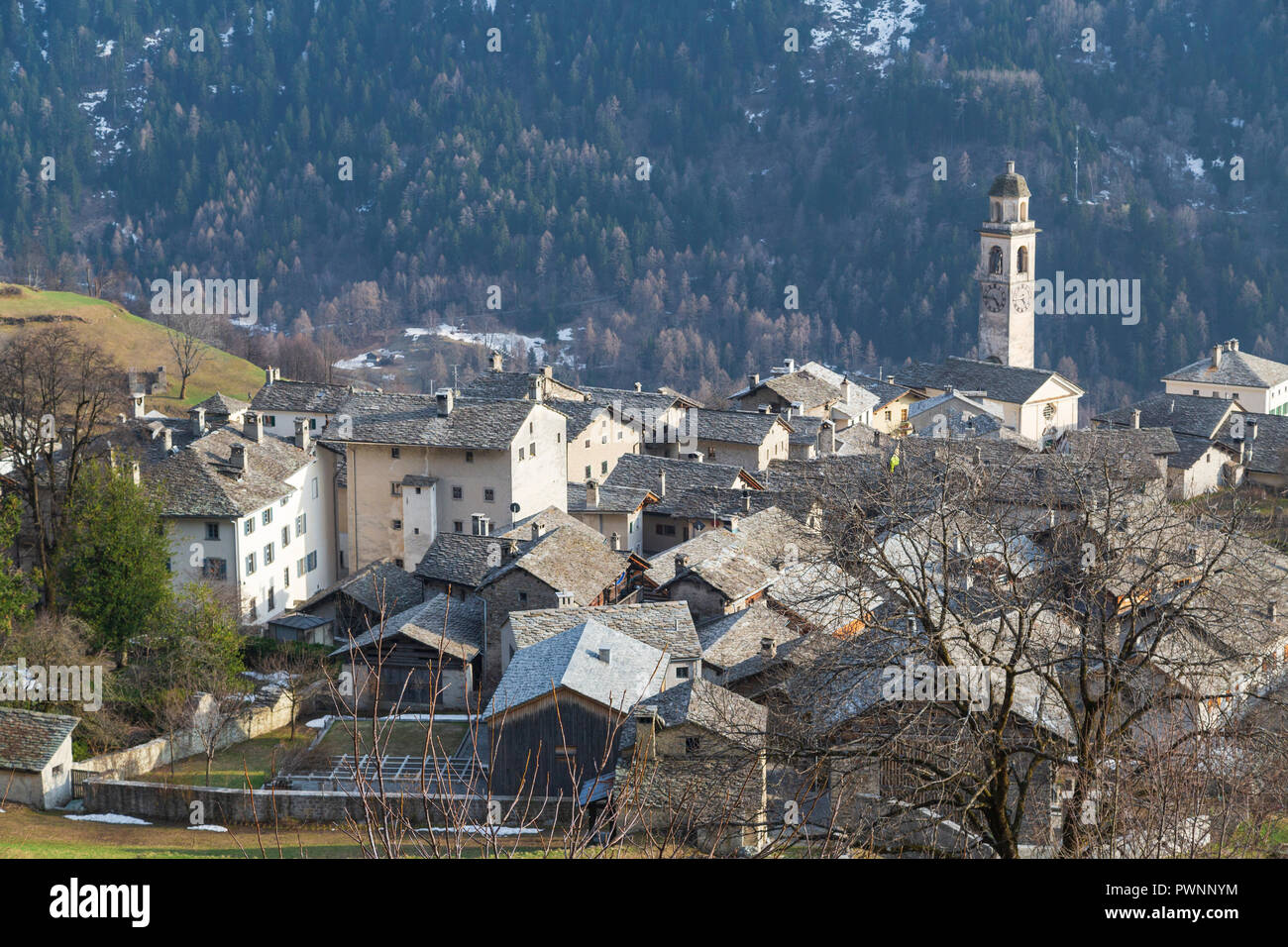 Stone roofs and bell tower in the alpine village of Soglio, Bregaglia Valley, Maloja Region, Canton of Graubunden, Switzerland Stock Photo