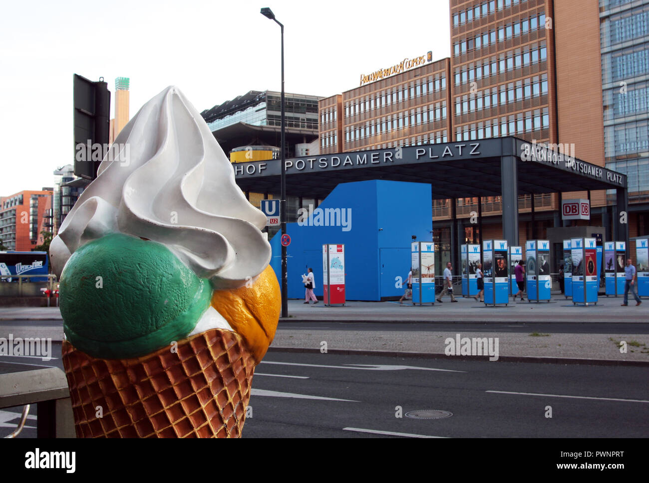 A giant ice cream cone stands opposite the Potsdamer Platz railway