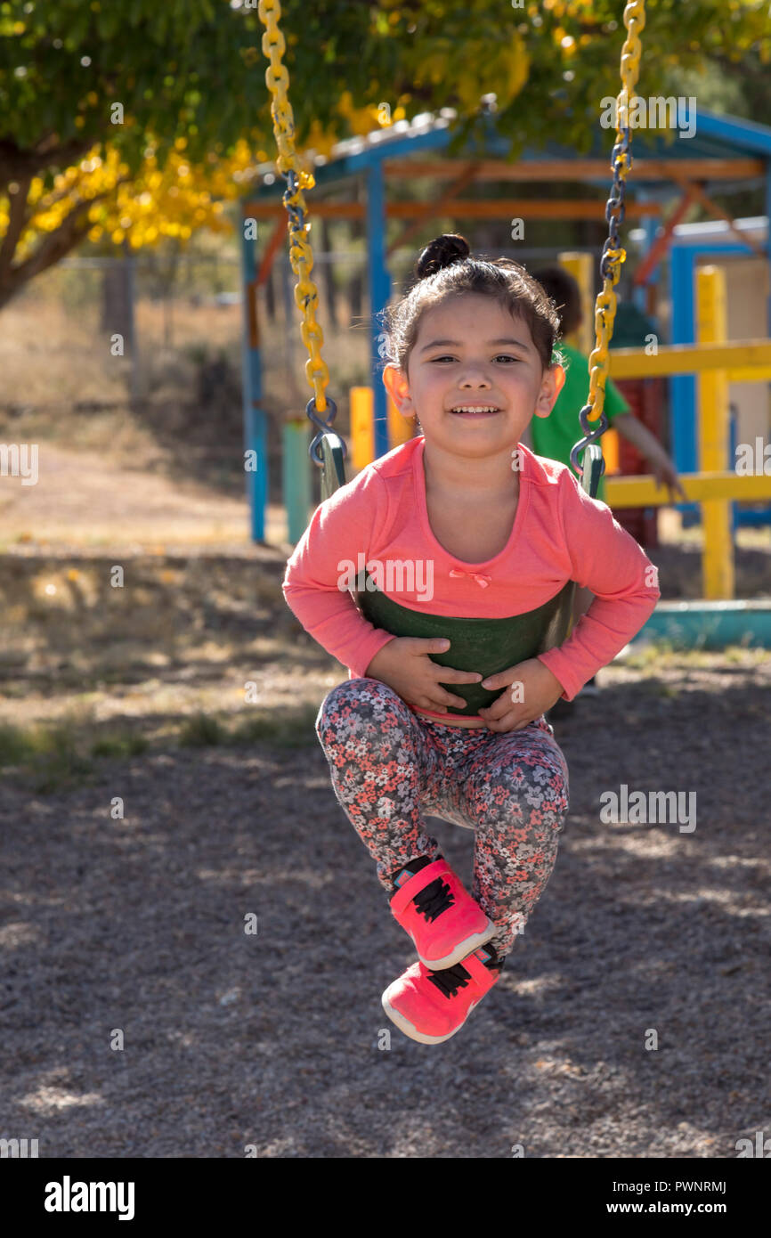 Alpine, Texas - A girl on the playground at the Alpine Community Center. The Center is a mission project of United Methodist Women. Stock Photo