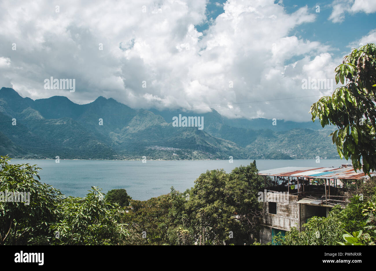 View over the lush and blue landscape around Lake Atitlán, Guatemala Stock Photo