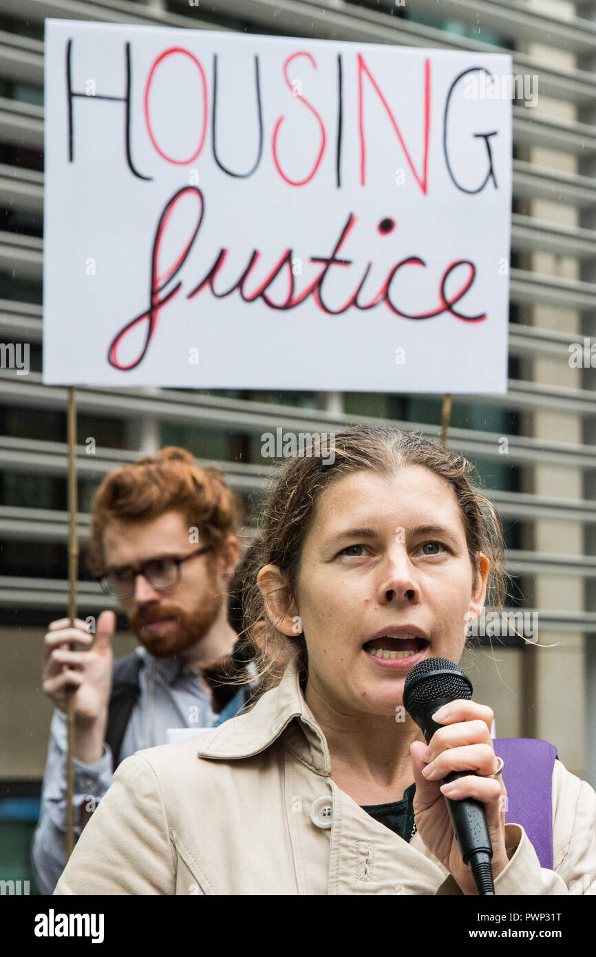 London, UK. 17th October, 2018. Claire James of the Climate Against Climate Change addresses tower block residents and supporters of grassroots campaign group Fuel Poverty Action at a protest outside the Ministry of Housing, Communities and Local Government to demand urgent action and funding to protect tower block residents both from fire and from cold. A letter signed by 140 signatories including MPs, councillors, trade union bodies and campaign groups focused on housing, poverty, discrimination, health, energy and climate was also presented. Credit: Mark Kerrison/Alamy Live News Stock Photo