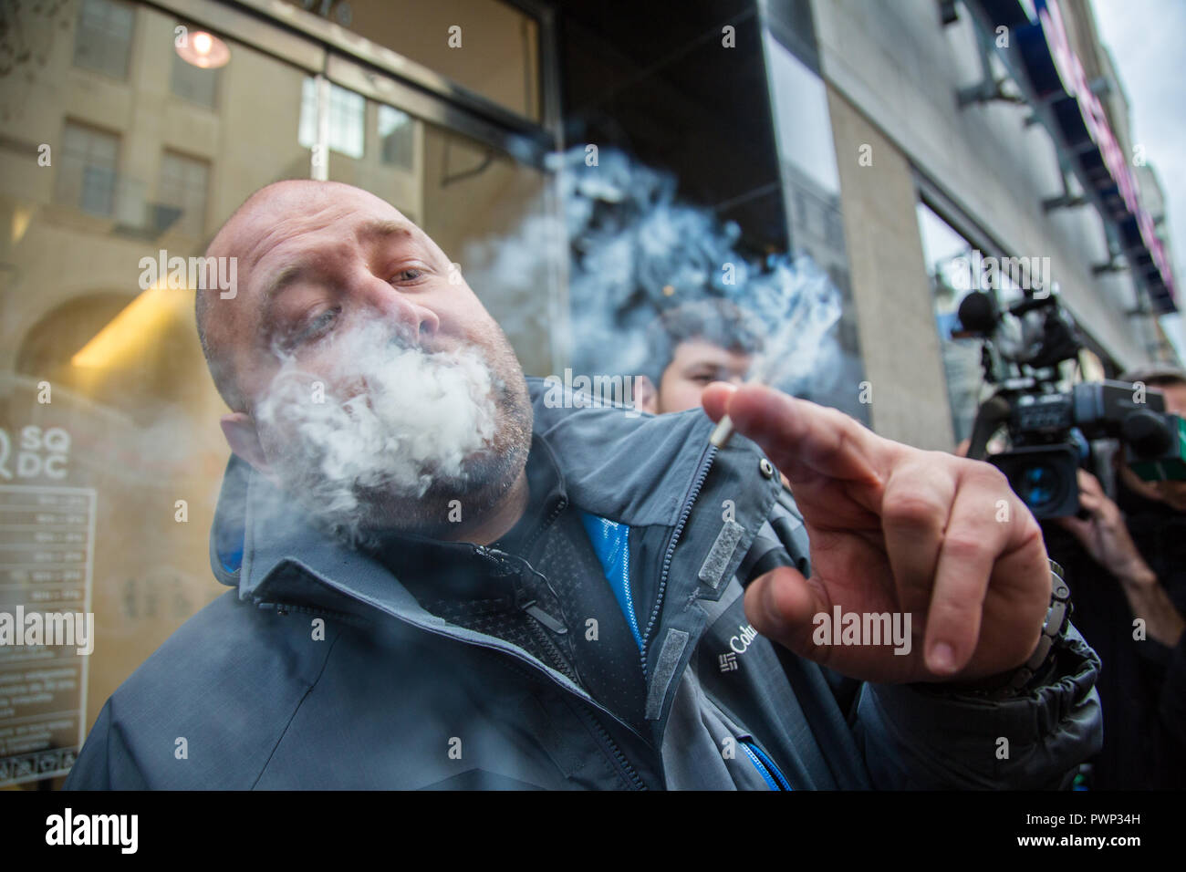 Montreal, Canada. 17th Oct, 2018. Hugo Senecal, a 39-year-old Montrealer who was at the head of that line on Montreal's Sainte Catherine street, waited since 3:30 am to be the first to buy legal marijuana at that store. Credit: Cristian Mijea/Alamy Live News Stock Photo