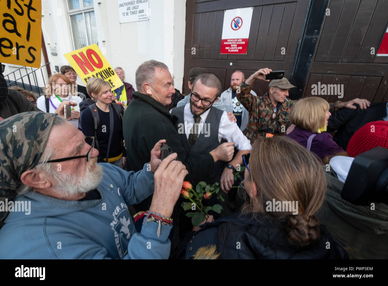 Preston Jail, Preston UK. 17th. Oct. 2018: Three anti-fracking protesters were released from Preston Jail after they successfully appealed their sentences. The  appeal judge commented that the year and a half sentences were drastic for the protest they carried out when they halted deliveries to the Cuadrilla exploratory shale gas site near Blackpool. A small crowd of supporters welcomed them as the left jail. Credit: Dave Ellison/Alamy Live News Stock Photo