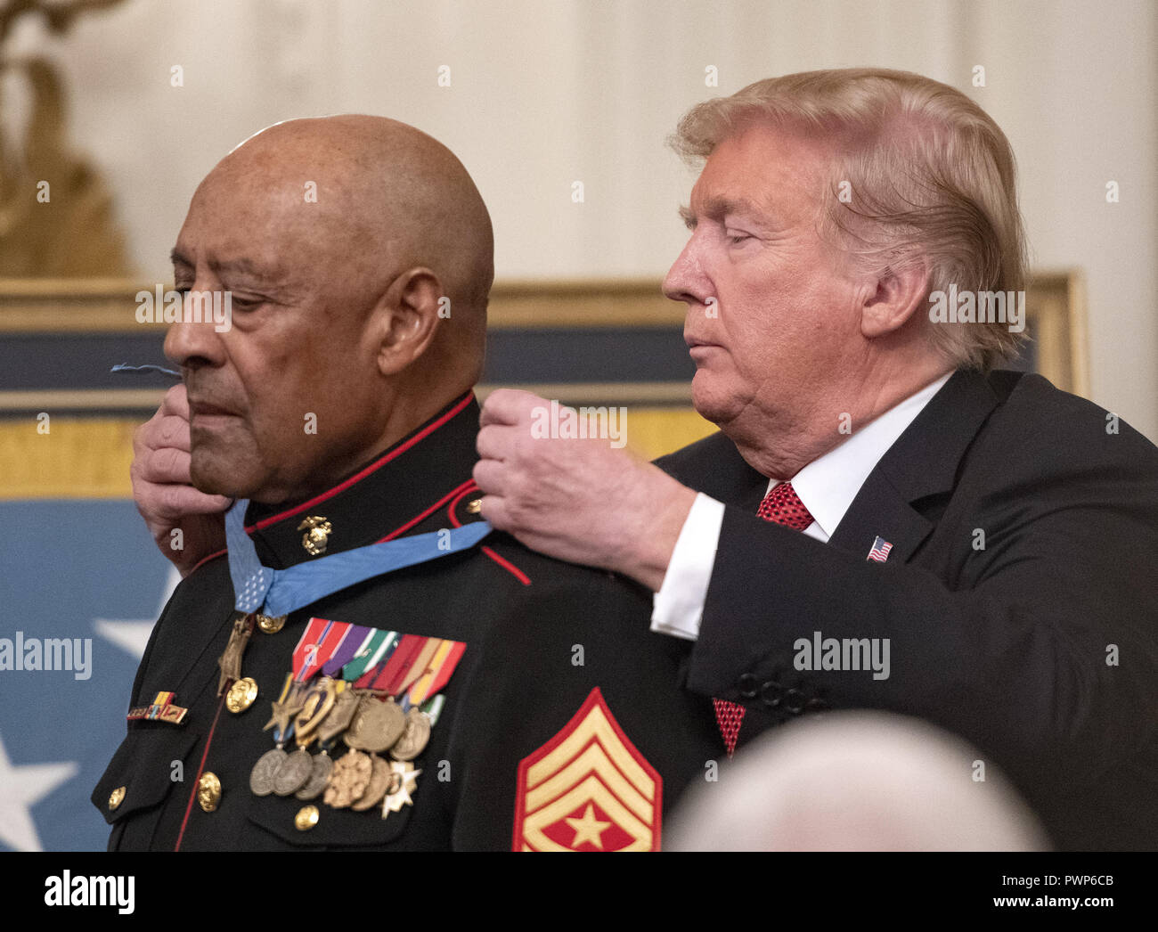 Washington, District of Columbia, USA. 17th Oct, 2018. United States President Donald J. Trump awards the Medal of Honor to Sergeant Major John L. Canley, United States Marine Corps (Retired), for conspicuous gallantry during the Vietnam War in a ceremony in the East Room of the the White House in Washington, DC on Wednesday, October 17, 2018 Credit: Ron Sachs/CNP/ZUMA Wire/Alamy Live News Stock Photo