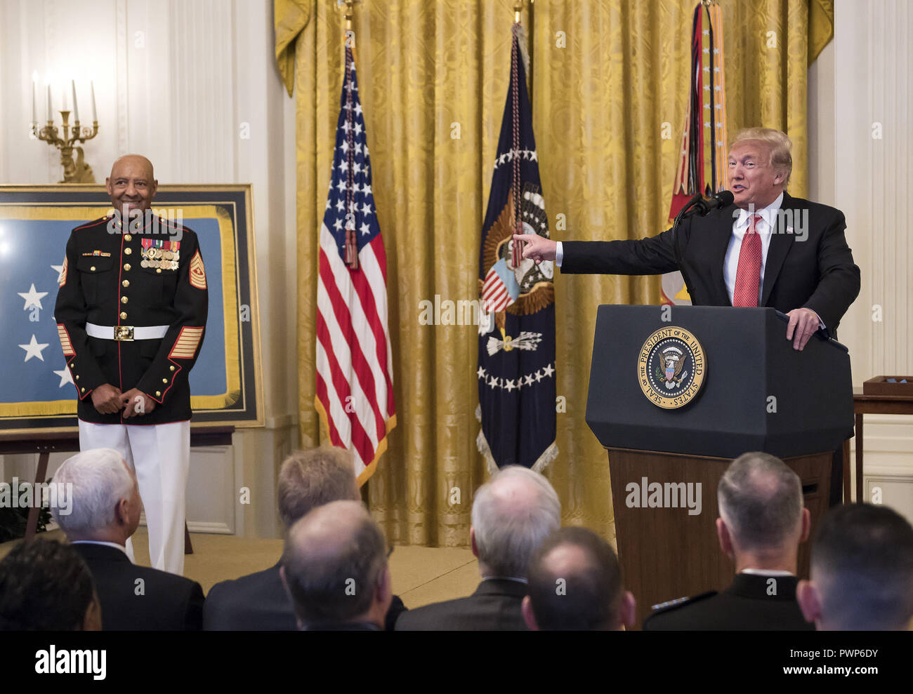 Washington, District of Columbia, USA. 17th Oct, 2018. Credit: Chip Somodevilla/Pool via CNPUnited States President Donald J. Trump awards the Medal of Honor to Sergeant Major John L. Canley, United States Marine Corps (Retired), for conspicuous gallantry during the Vietnam War in a ceremony in the East Room of the the White House in Washington, DC on Wednesday, October 17, 2018 Credit: Ron Sachs/CNP/ZUMA Wire/Alamy Live News Stock Photo