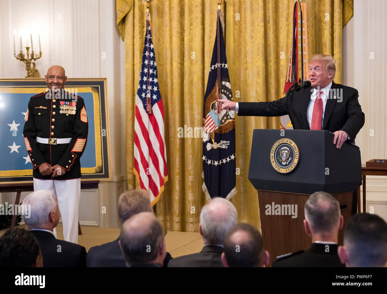 Washington, USA. 17th Oct 2018. Credit: Chip Somodevilla/Pool via CNPUnited States President Donald J. Trump awards the Medal of Honor to Sergeant Major John L. Canley, United States Marine Corps (Retired), for conspicuous gallantry during the Vietnam War in a ceremony in the East Room of the the White House in Washington, DC on Wednesday, October 17, 2018. Credit: Ron Sachs/CNP/MediaPunch Credit: MediaPunch Inc/Alamy Live News Stock Photo