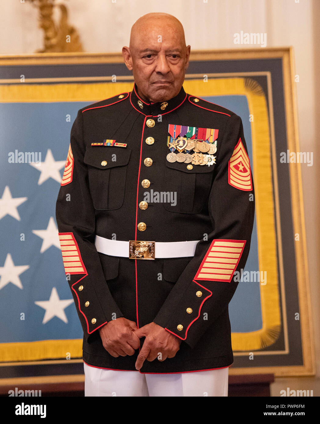 Washington, USA. 17th Oct 2018. Sergeant Major John L. Canley, United States Marine Corps (Retired) listens as US President Donald J. Trump makes remarks where he will be awarded him the Medal of Honor for conspicuous gallantry during the Vietnam War in a ceremony in the East Room of the the White House in Washington, DC on Wednesday, October 17, 2018. Credit: Ron Sachs/CNP/MediaPunch Credit: MediaPunch Inc/Alamy Live News Stock Photo