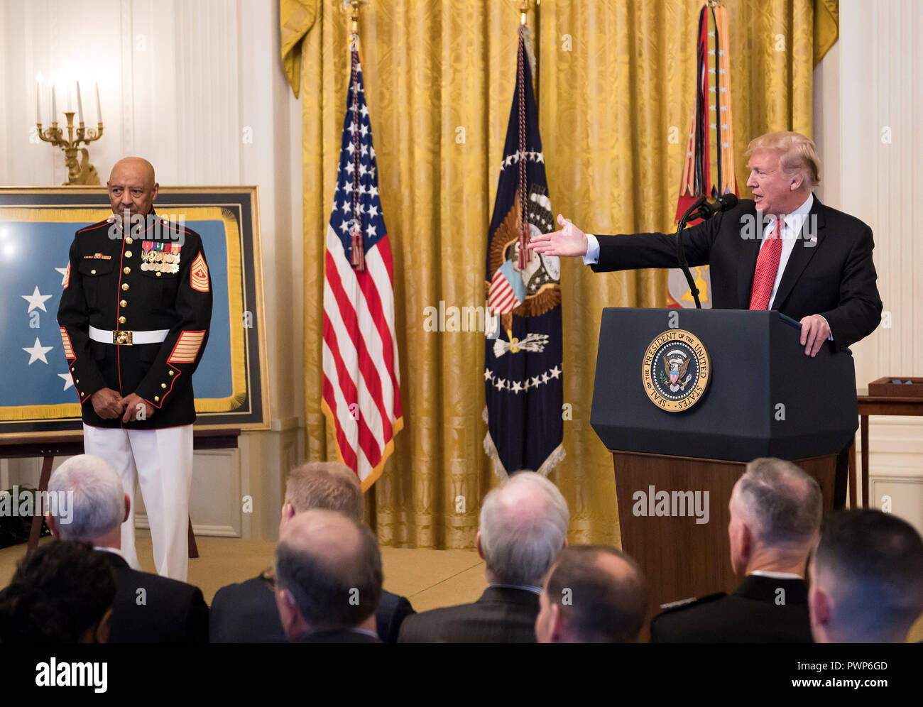 Washington, USA. 17th Oct 2018. United States President Donald J. Trump awards the Medal of Honor to Sergeant Major John L. Canley, US Marine Corps (Retired), for conspicuous gallantry during the Vietnam War in a ceremony in the East Room of the the White House in Washington, DC on Wednesday, October 17, 2018. Credit: Ron Sachs/CNP/MediaPunch Credit: MediaPunch Inc/Alamy Live News Stock Photo