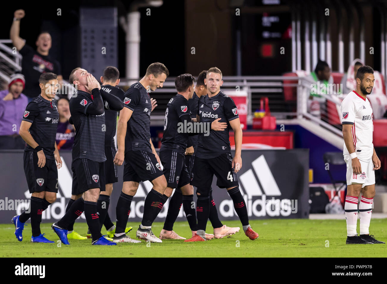 Columbia. 17th Oct, 2018. D.C. United forward Wayne Rooney (9) celebrates with teammates after scoring during the MLS game between D.C. United and Toronto FC at Audi Field in Washington, District of Columbia. Scott Taetsch/CSM/Alamy Live News Stock Photo