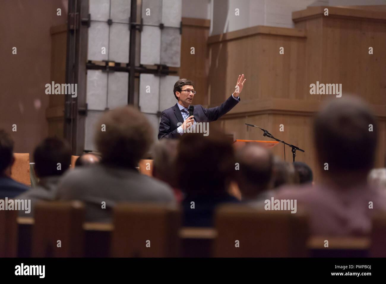 Seattle, Washington DC, USA. 17th Oct 2018. Attorney General Bob Ferguson speaks to supporters at St. Mark's Episcopal Cathedral during a discussion on the current state immigration. “Immigration Reform in Washington State” was hosted by St. Mark's Episcopal Cathedral and included a panel with representatives from Casa Latina, El Centro de la Raza and the Church Council of Greater Seattle. Credit: Paul Christian Gordon/Alamy Live News Stock Photo