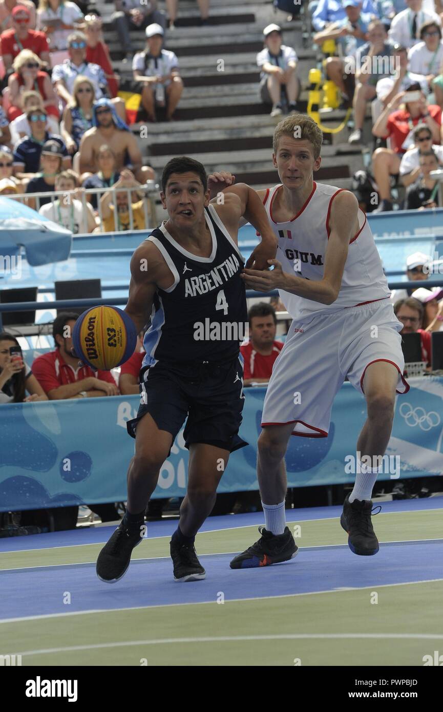 October 17, 2018 - Buenos Aires, Buenos Aires, Argentina - FERRE  VANDERHOYDONCK of Belgium shadows MARCO GIORDANO GNASS of Argentina as he  attacks during the Basketball 3x3 match in which ARGENTINA won