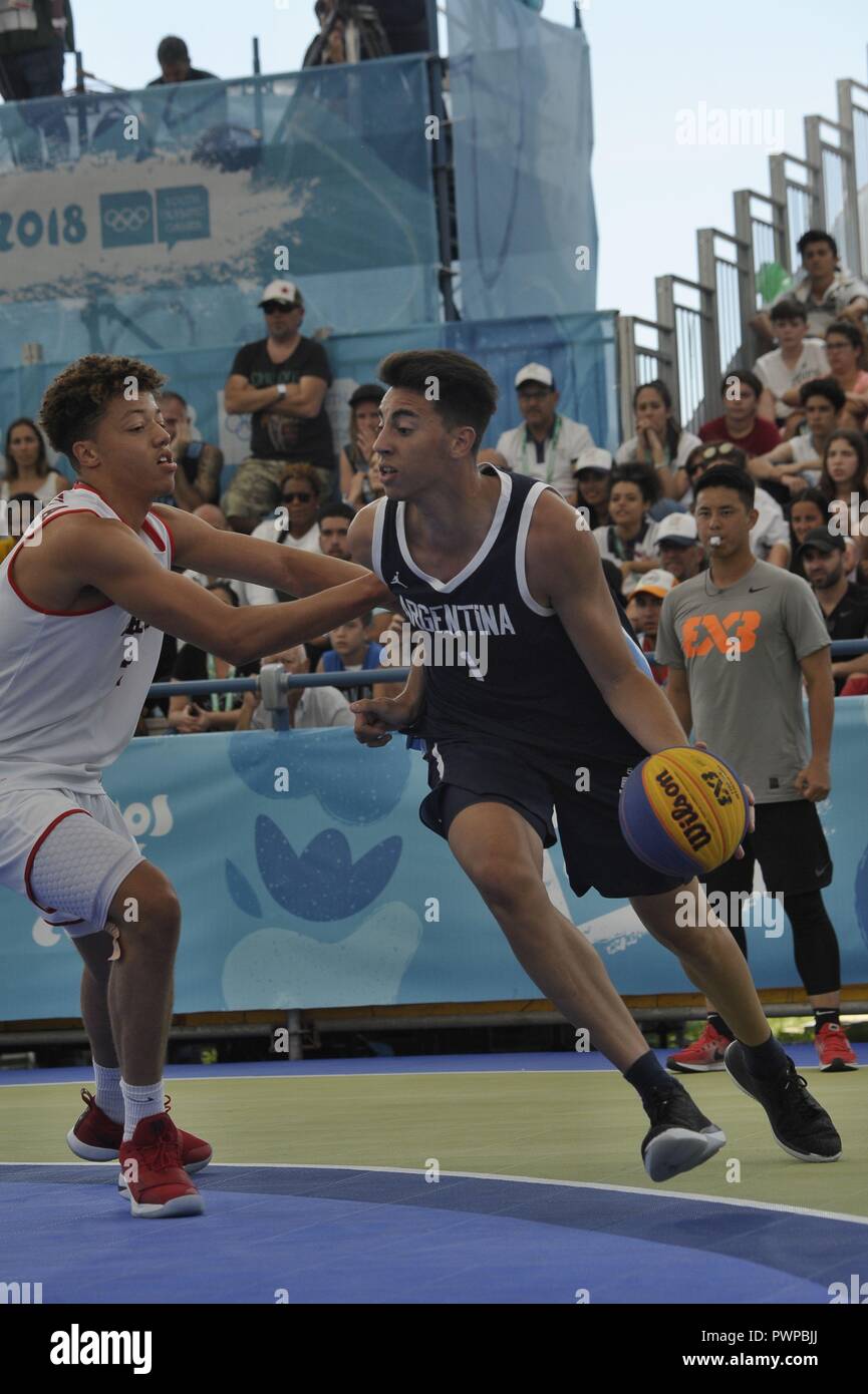 October 17, 2018 - Buenos Aires, Buenos Aires, Argentina - JUAN SANTIAGO  HIERREZUELO SERER of Argentina, shadowed by MOUSA ROBERT SYLLA NOTERMAN of  Belgium, attacks during the Basketball 3x3 match in which
