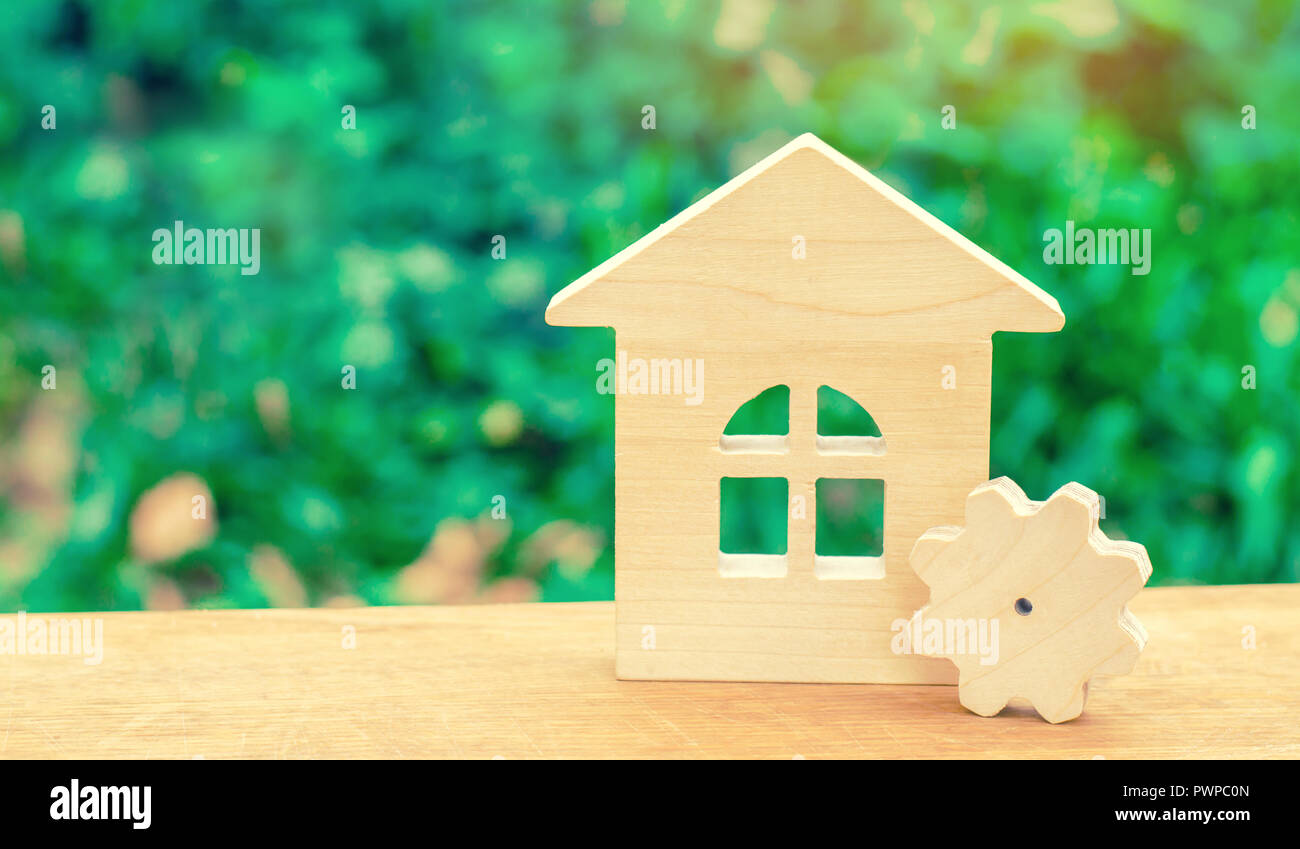 Wooden House And Gear Concept Of Project Development Energy
