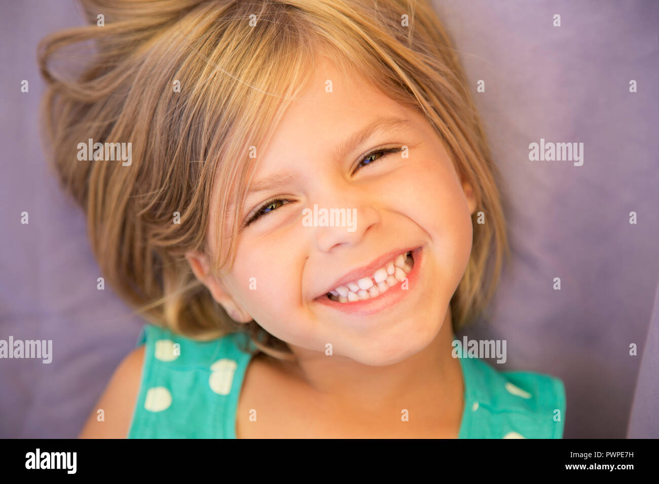 Portrait of a pretty little smiling blond girl Stock Photo - Alamy