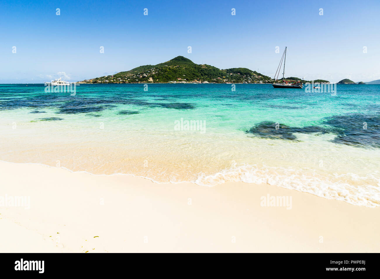 View on Petite-Martinique's island and a boat, Saint Vincent and the Grenadines, Lesser Antilles, West Indies, Windward Islands, Caribbean, Central America Stock Photo