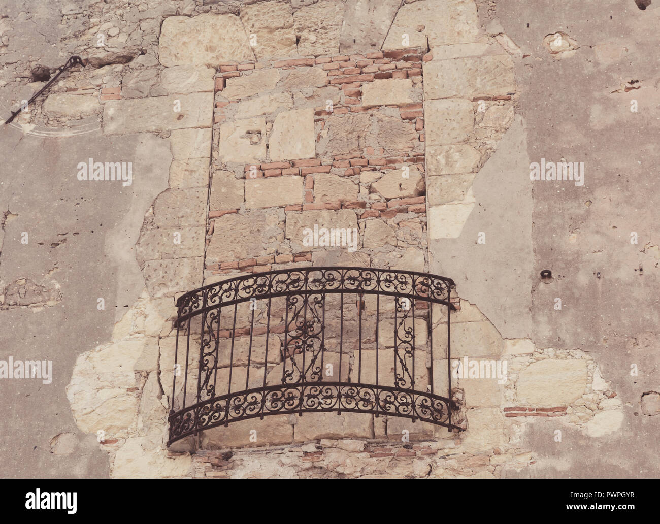 walled window with wrought iron balcony of old house in Castle quarter ...