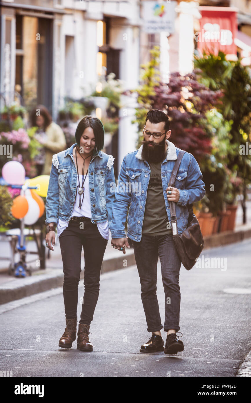 Young black couple walking down hi-res stock photography and images - Alamy